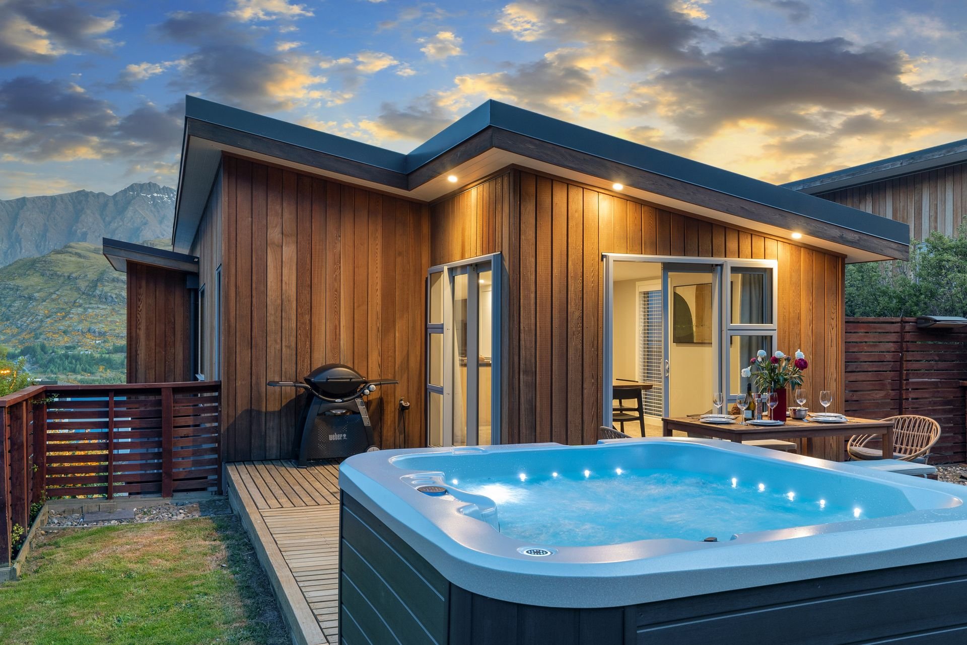 Private spa pool in the back garden at dusk at Highview Haven, Queenstown