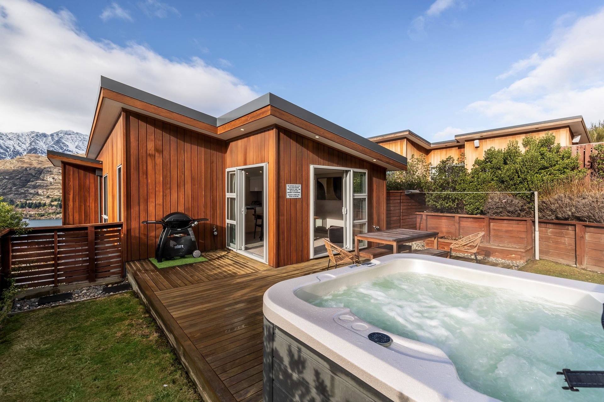 Back garden deck with spa pool at Highview Haven, Queenstown