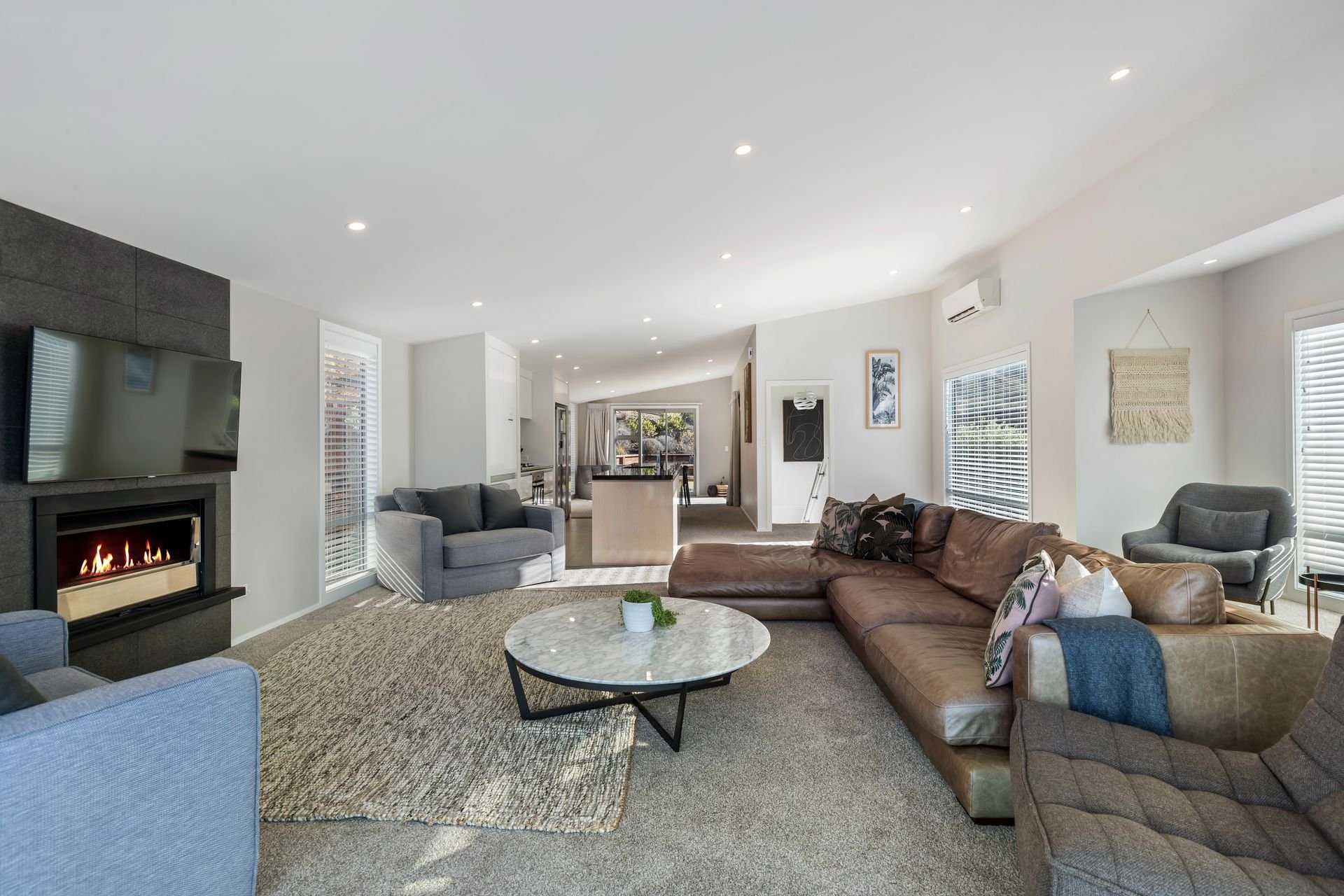 Living room with gas fire at Highview Haven, Queenstown