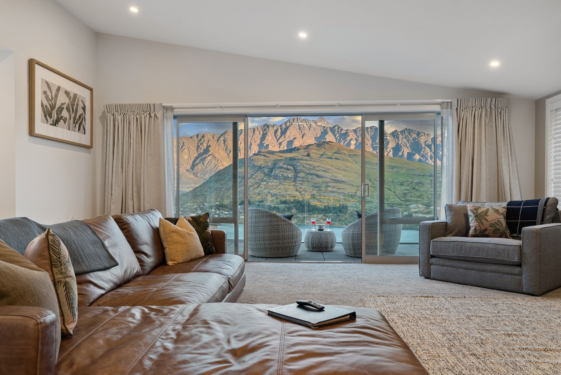 Lounge with sliding doors to the balcony at Highview Haven, Queenstown