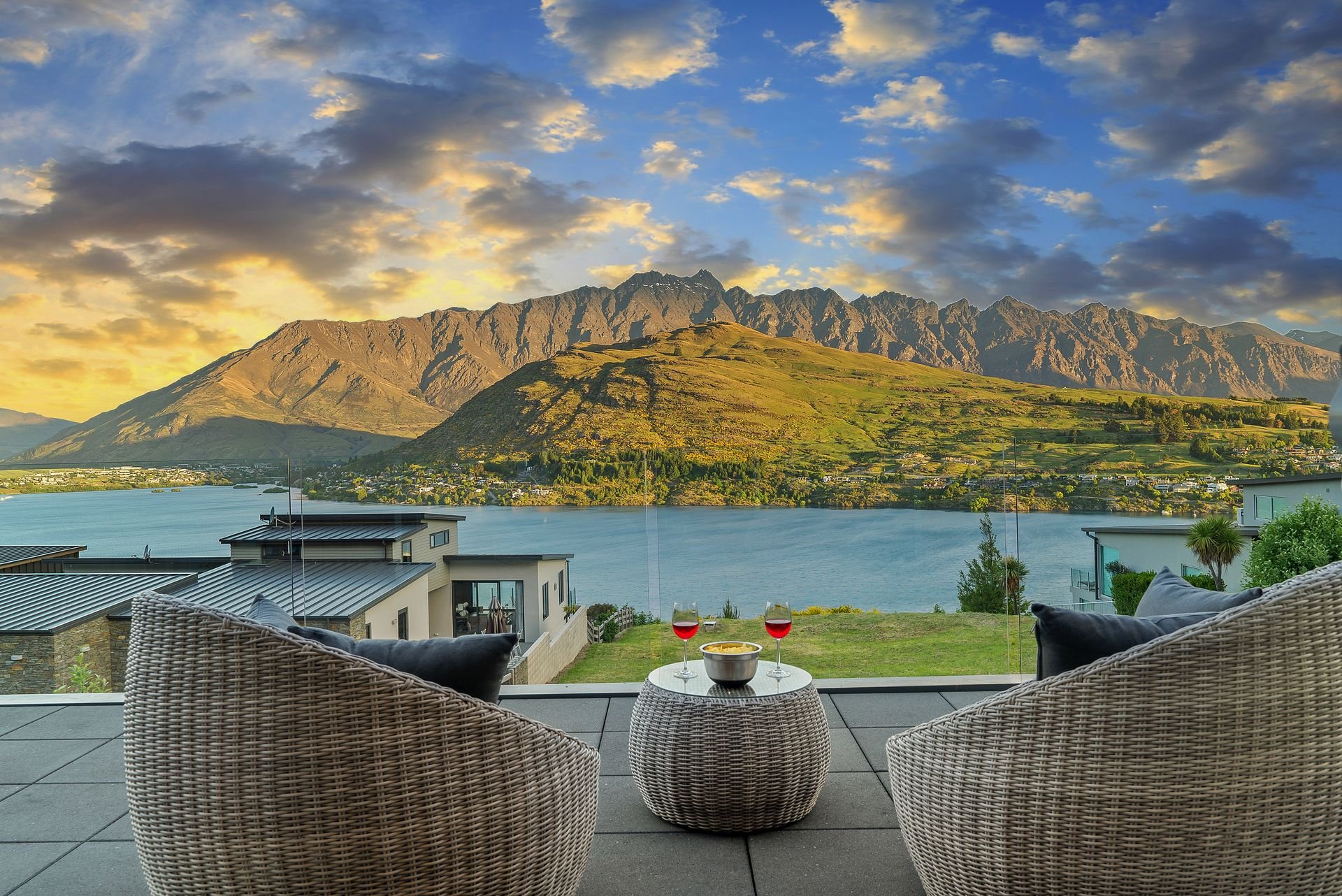 Balcony seating looking over the lake to the mountains at sunset at Highview Haven, Queenstown