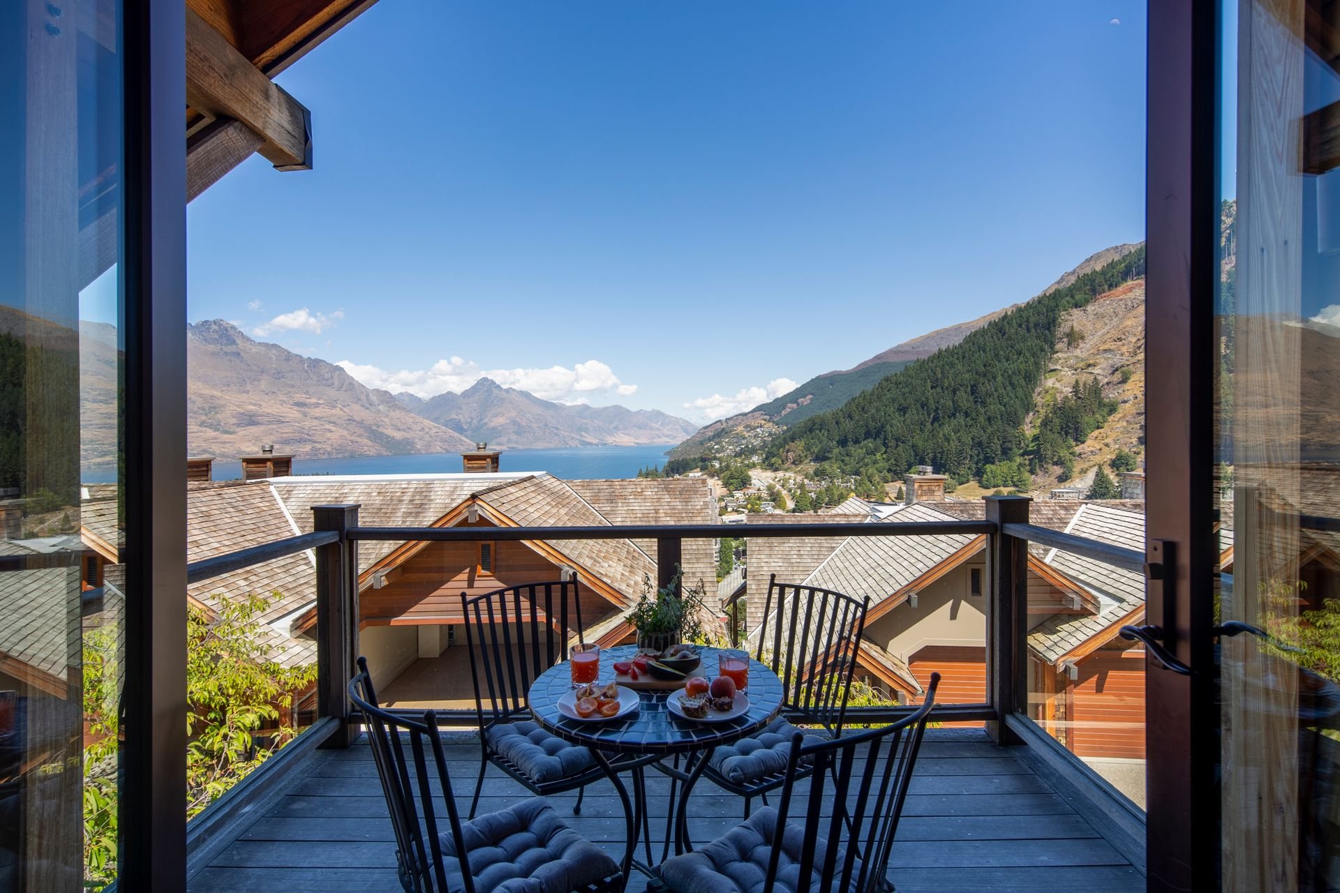 Balcony table with lake and mountain views at Karamata, Queenstown