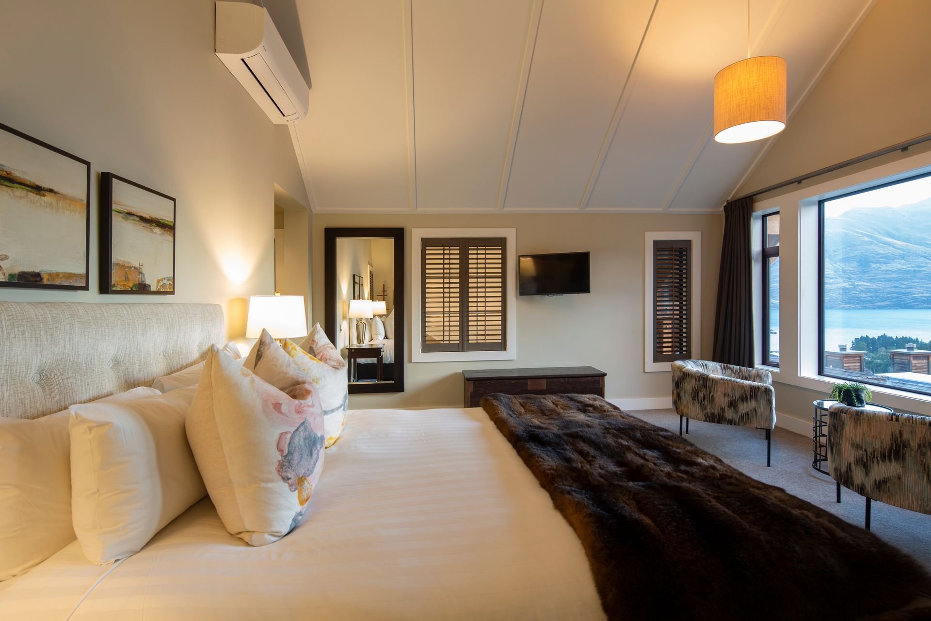 Bedroom with lake views at Karamata, Queenstown