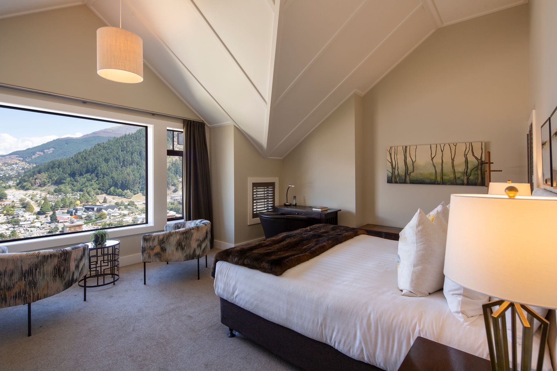 Bedroom with a window over Queenstown at Karamata, Queenstown