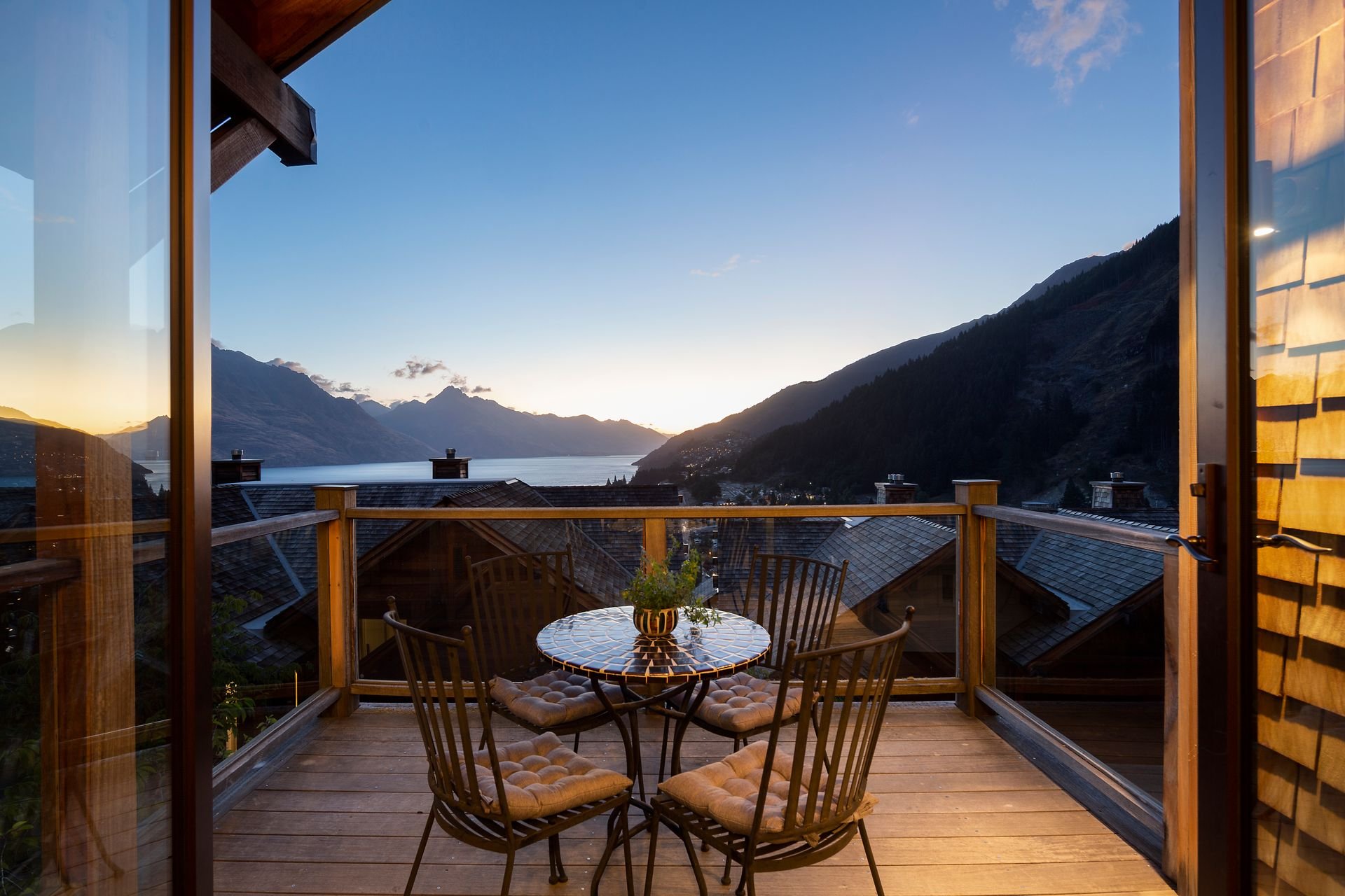 Balcony table at dusk overlooking Lake Whakatipu at Karamata, Queenstown
