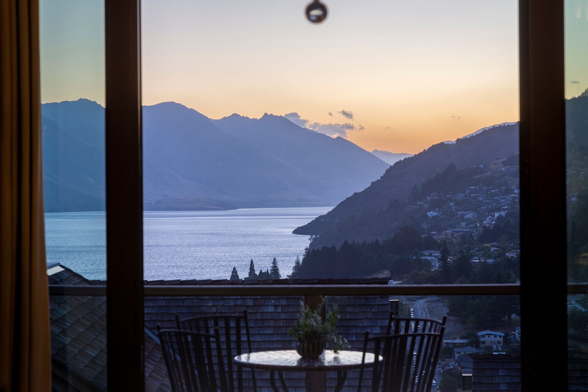 Sunset over the lake from the balcony at Karamata, Queenstown