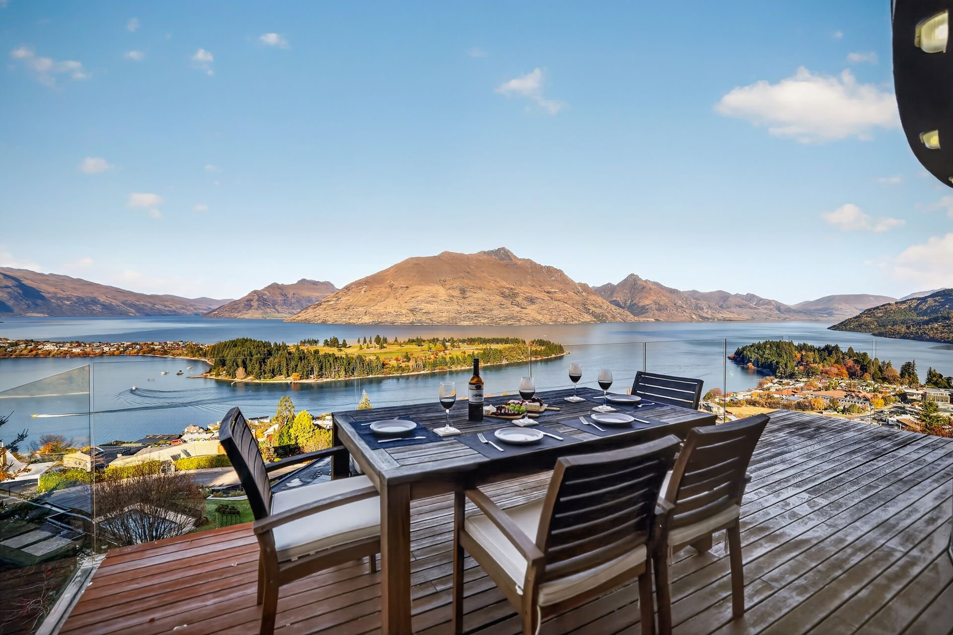Deck with outdoor dining table and lake views at Edinburgh Heights, Queenstown
