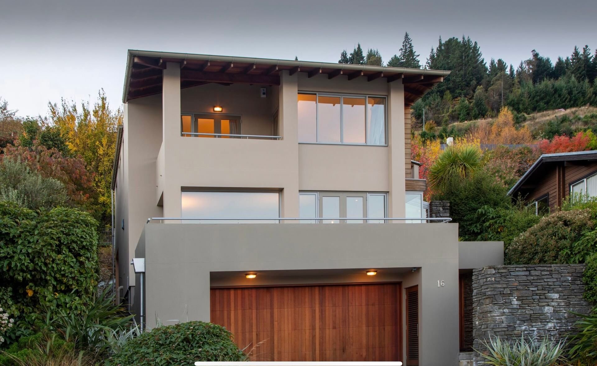 Exterior of the house with garage at Baraka Lake Views, Queenstown