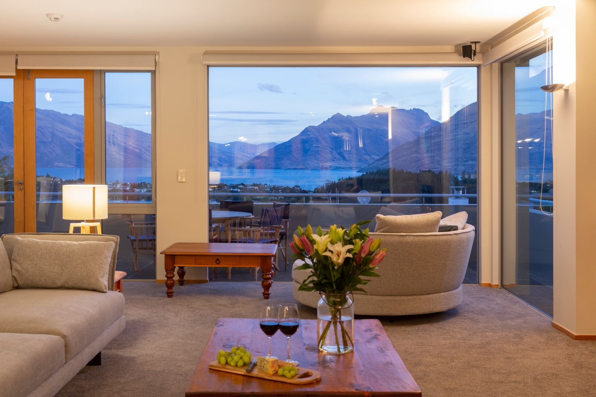 Corner lounge with views of the lake and mountains at Baraka Lake Views, Queenstown
