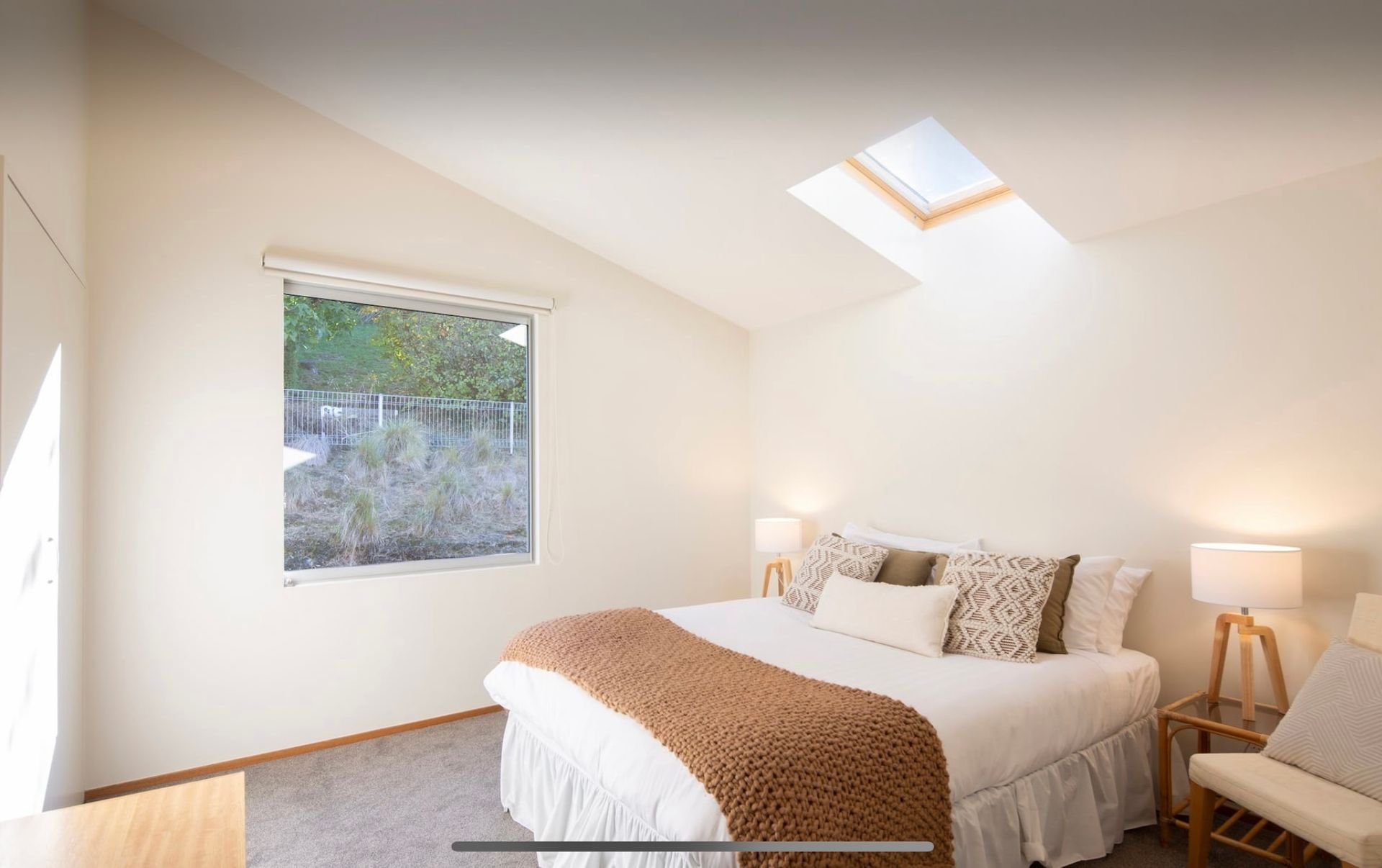 Bedroom with skylight at Baraka Lake Views, Queenstown