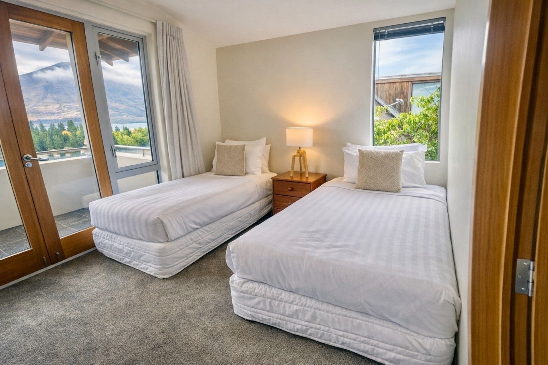 Twin bedroom with two single beds at Baraka Lake Views, Queenstown