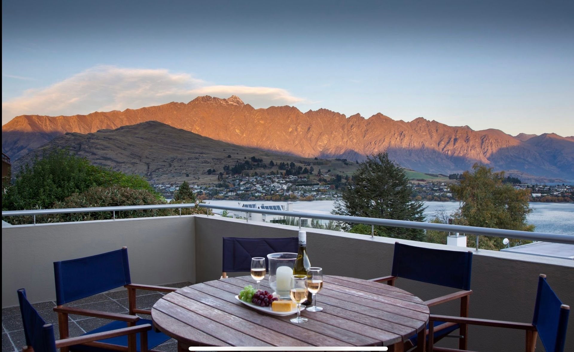 Balcony table with the Remarkables at sunset at Baraka Lake Views, Queenstown