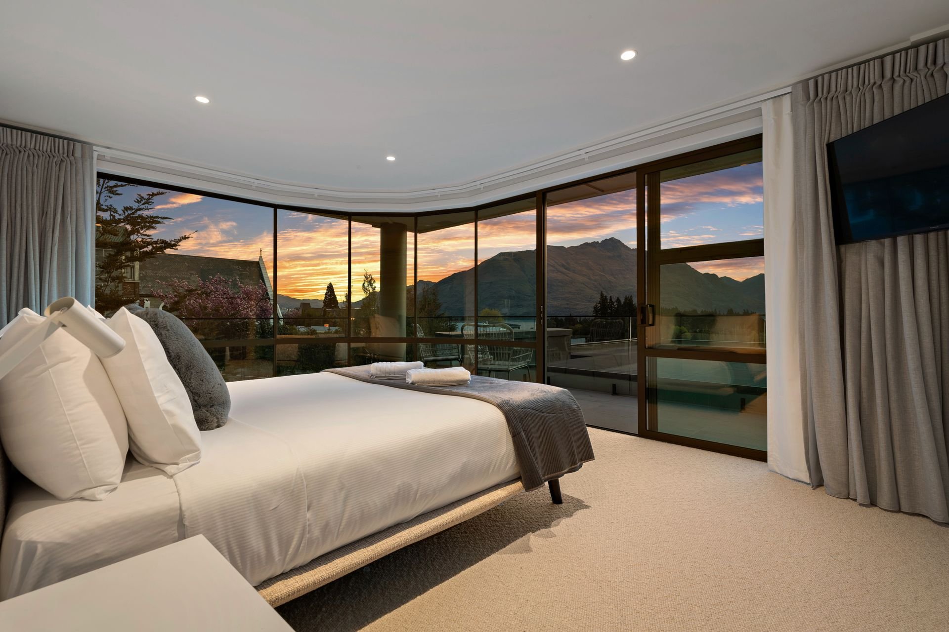 Master bedroom with lake views at Sunset Views, Queenstown