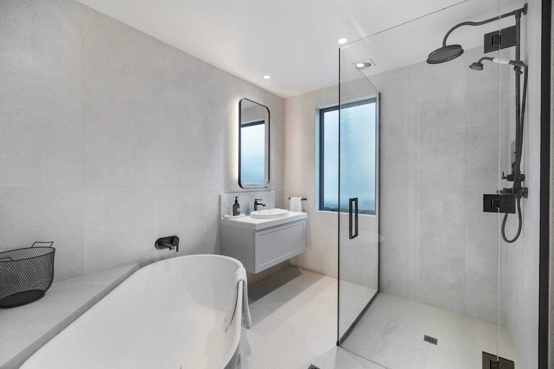 Bathroom with freestanding bath and shower at Sunset Views, Queenstown