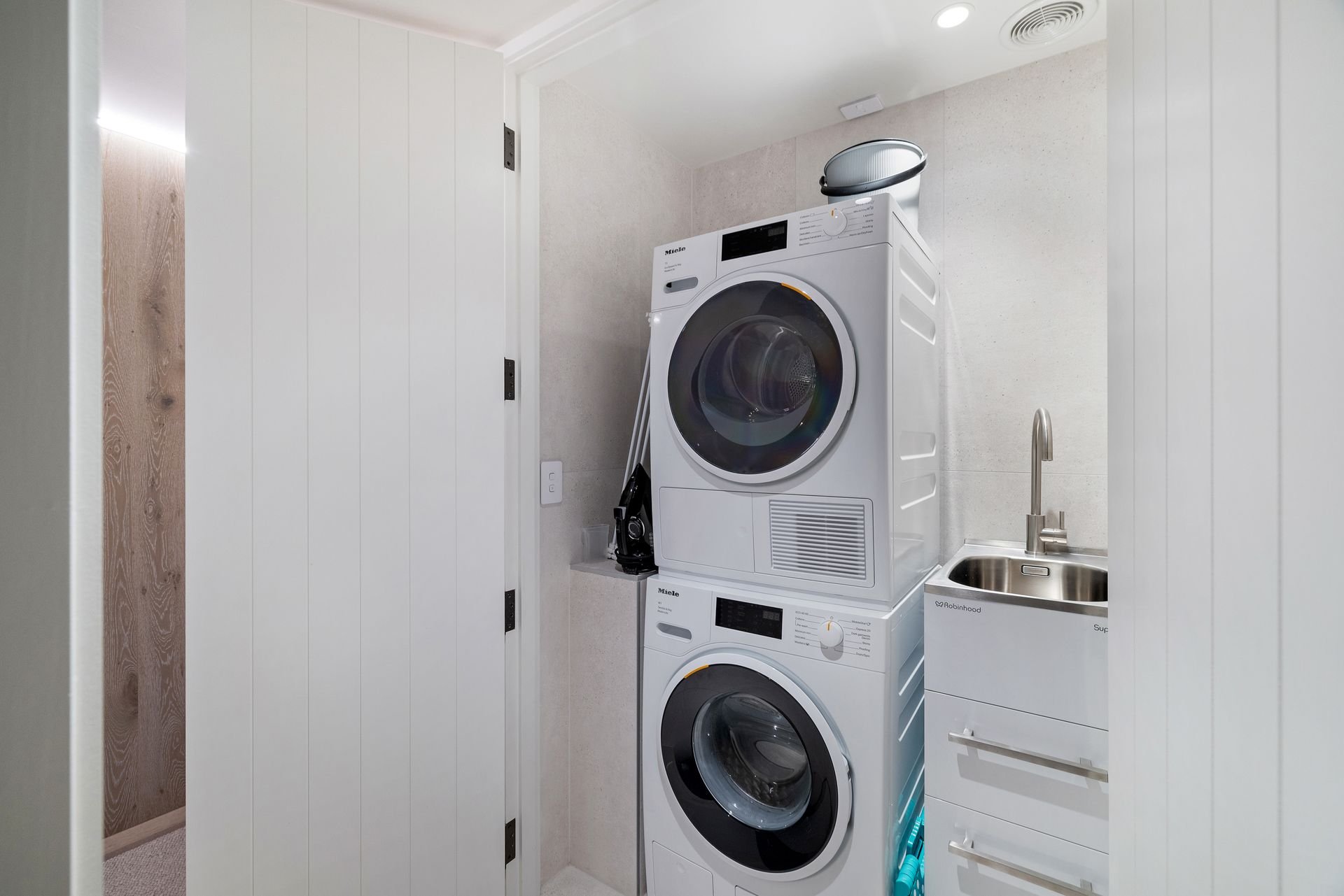 Laundry with washer and dryer at Sunset Views, Queenstown
