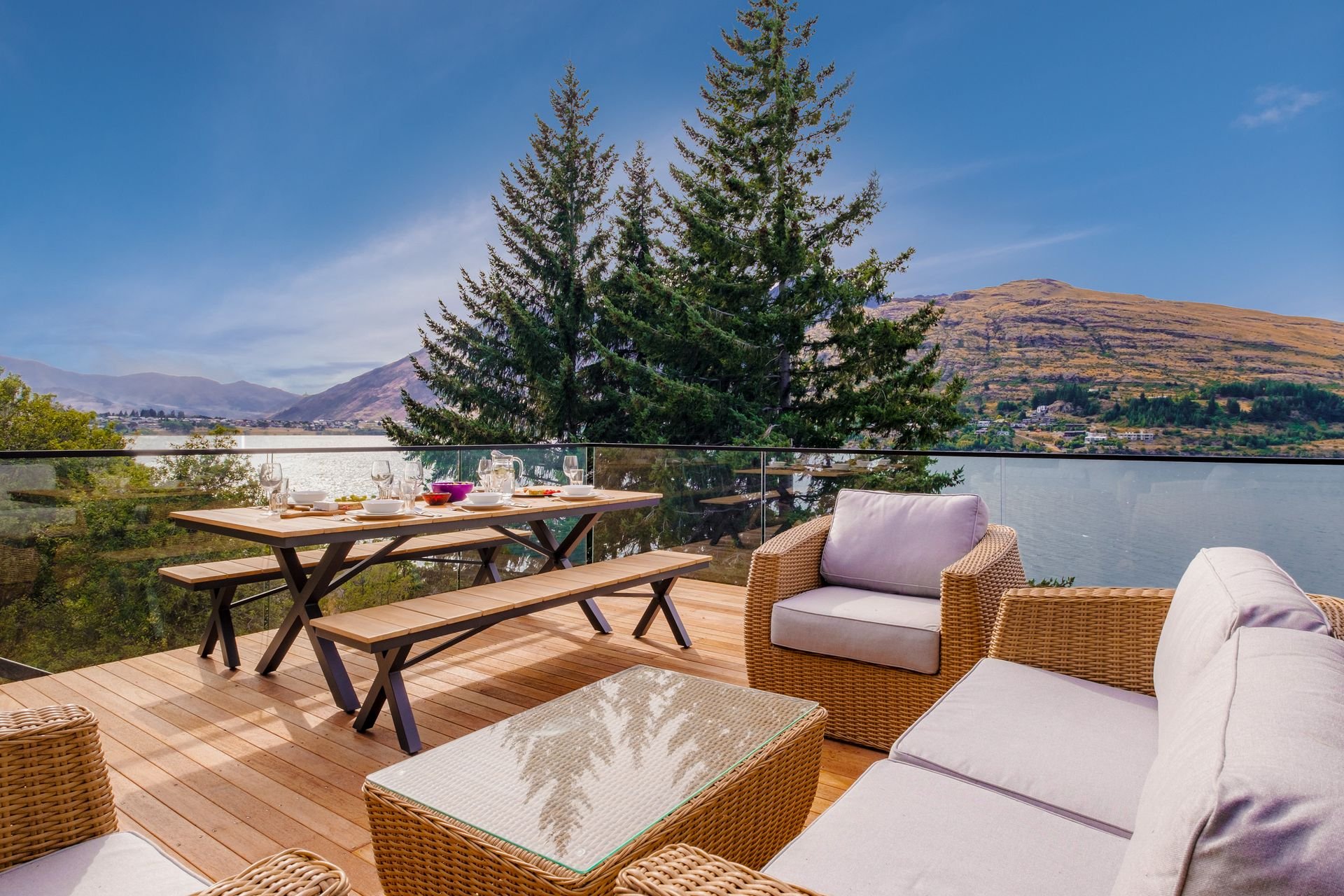 Deck with outdoor seating overlooking the lake at Queenstown Lakefront Dream, Queenstown