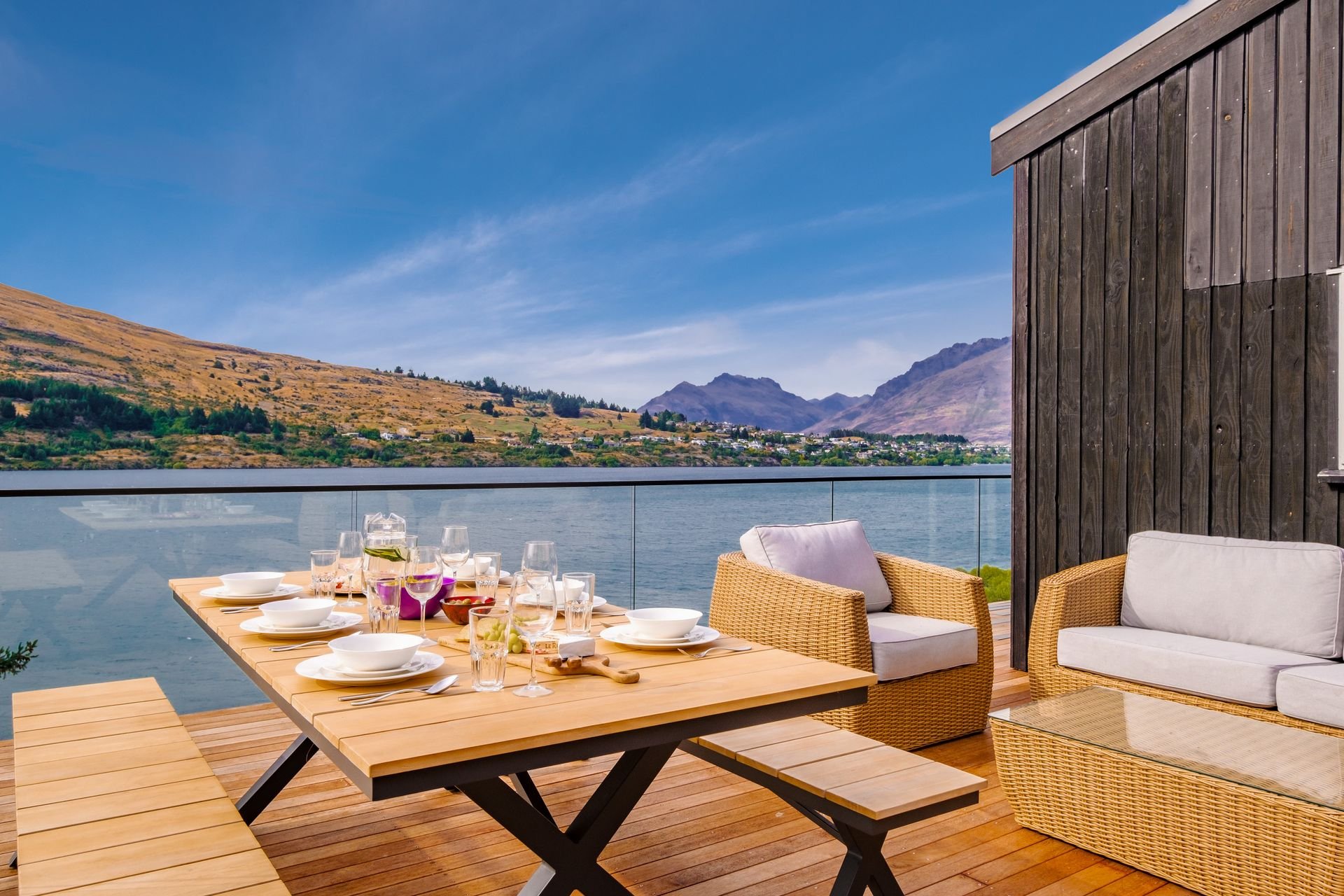 Outdoor dining table on the lakeside deck at Queenstown Lakefront Dream, Queenstown