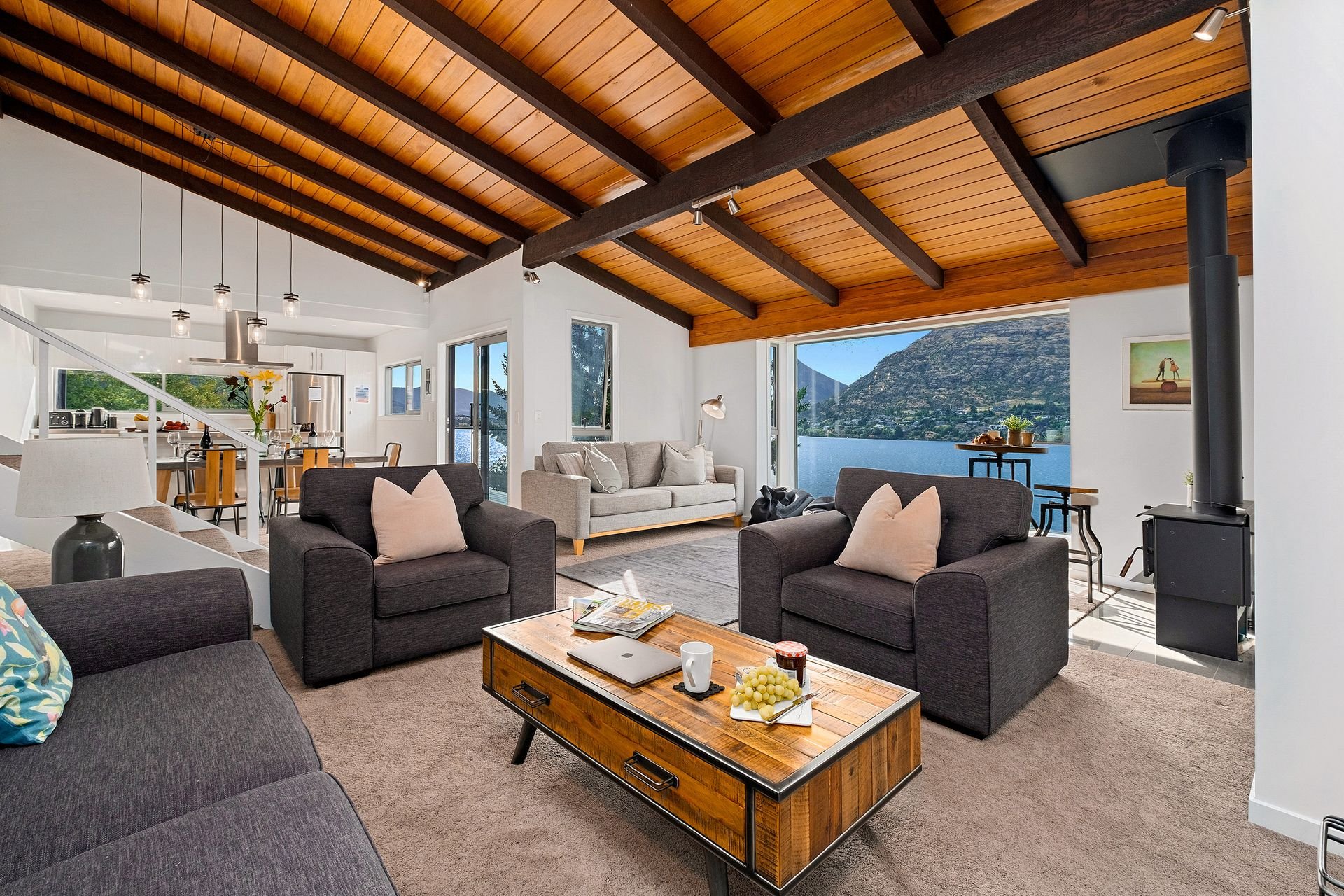 Open-plan lounge with timber beams at Queenstown Lakefront Dream, Queenstown