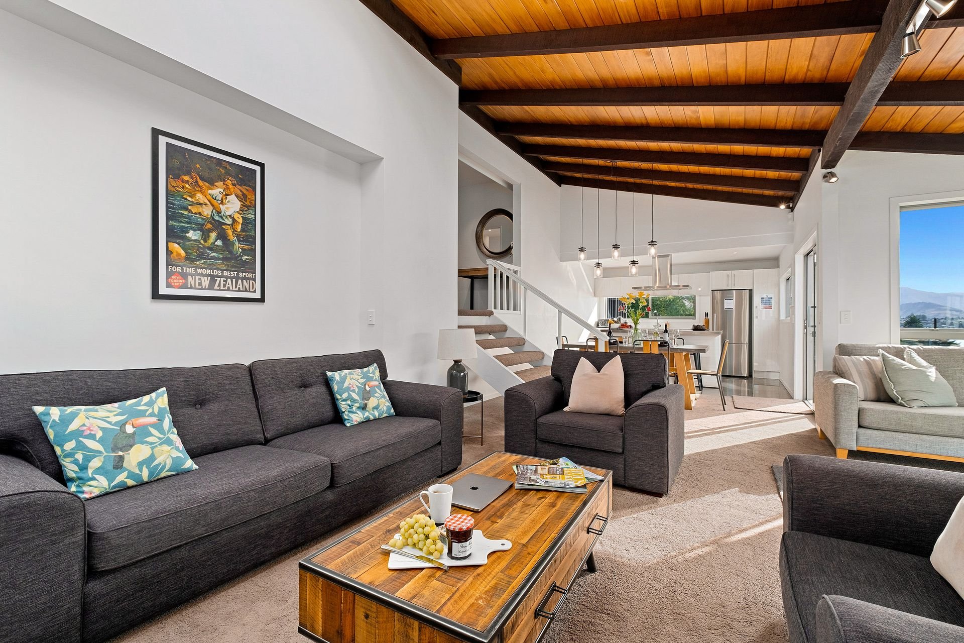 Lounge with sofas and timber ceiling at Queenstown Lakefront Dream, Queenstown