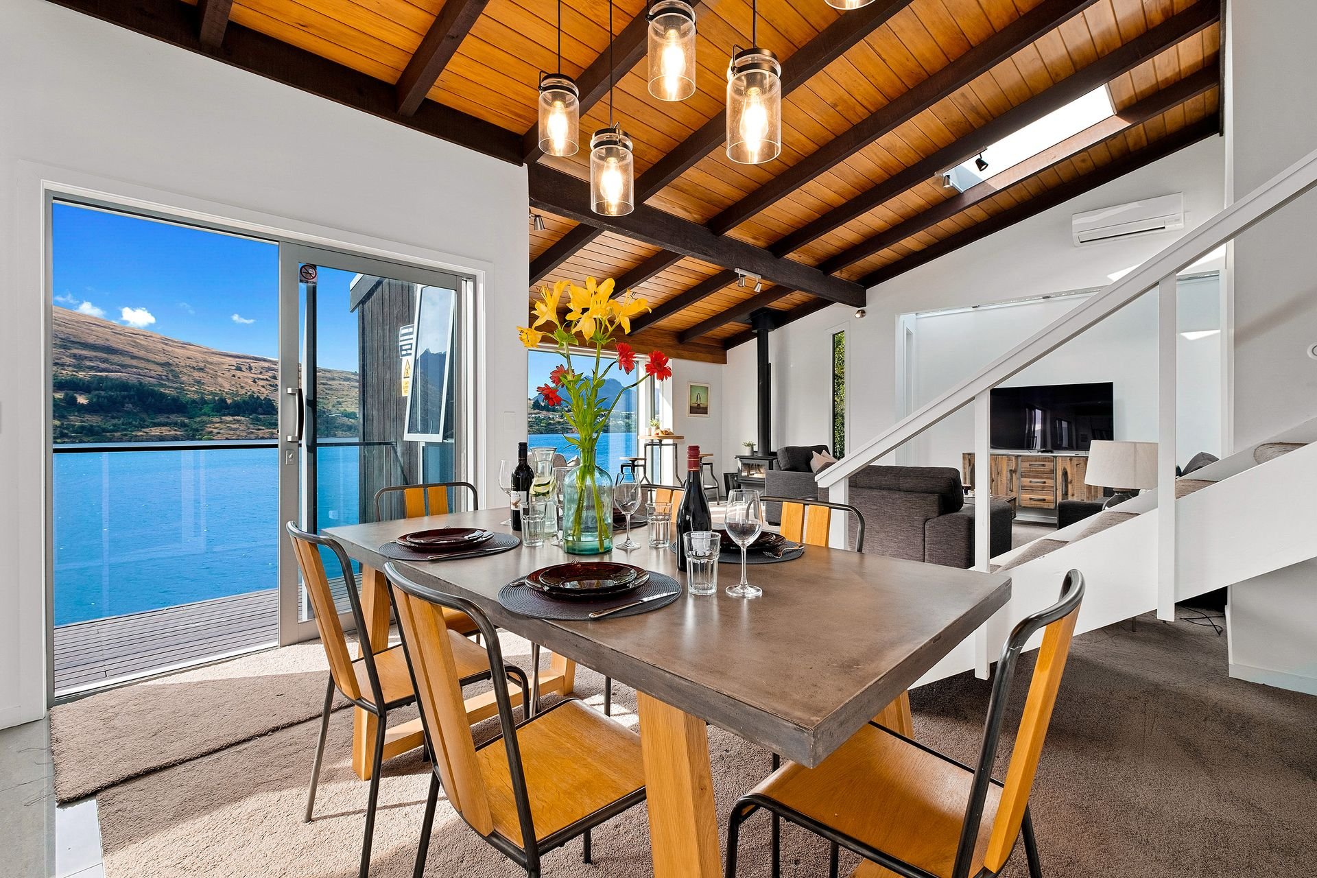 Dining table with lake views at Queenstown Lakefront Dream, Queenstown