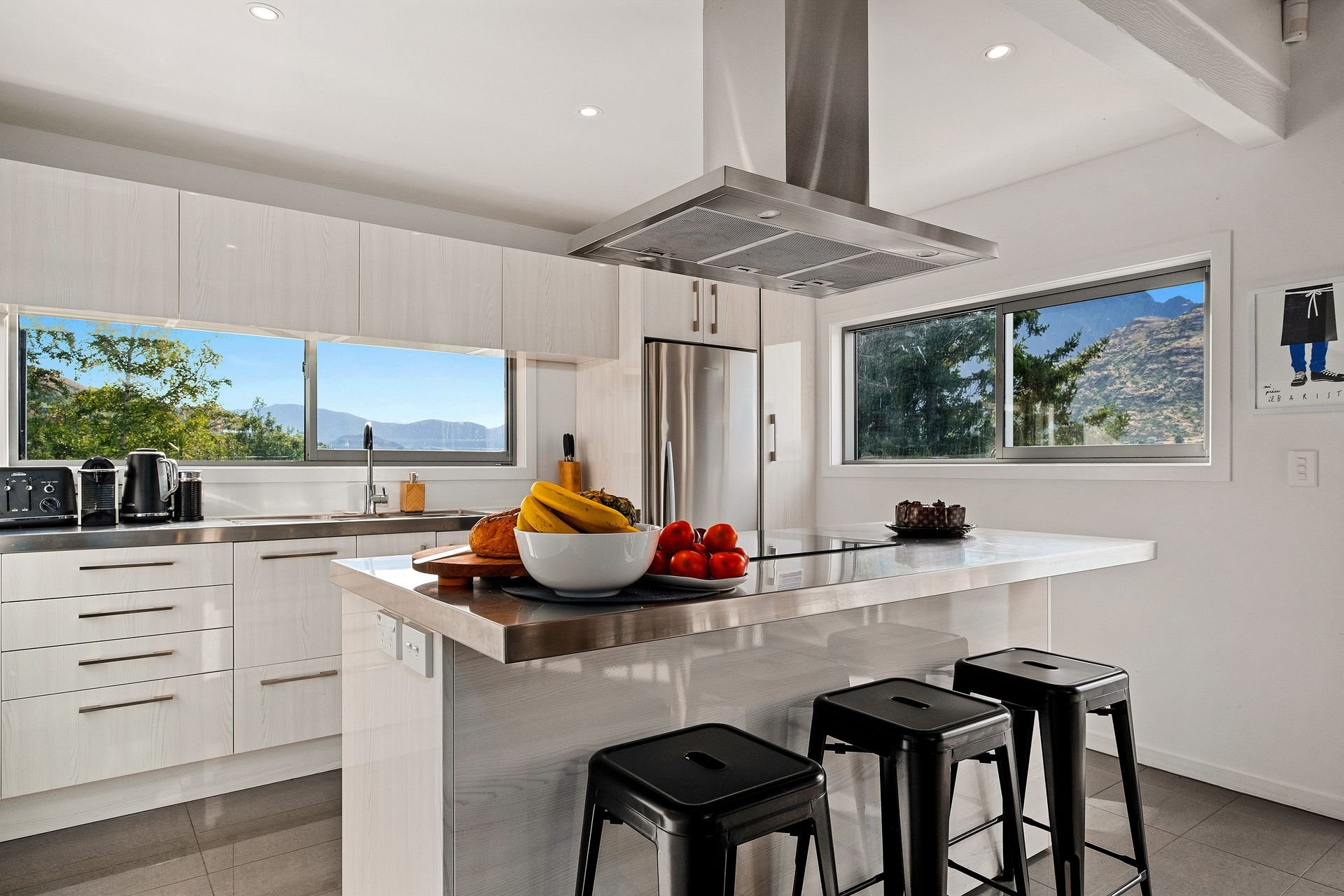 Kitchen with island bench and stools at Queenstown Lakefront Dream, Queenstown