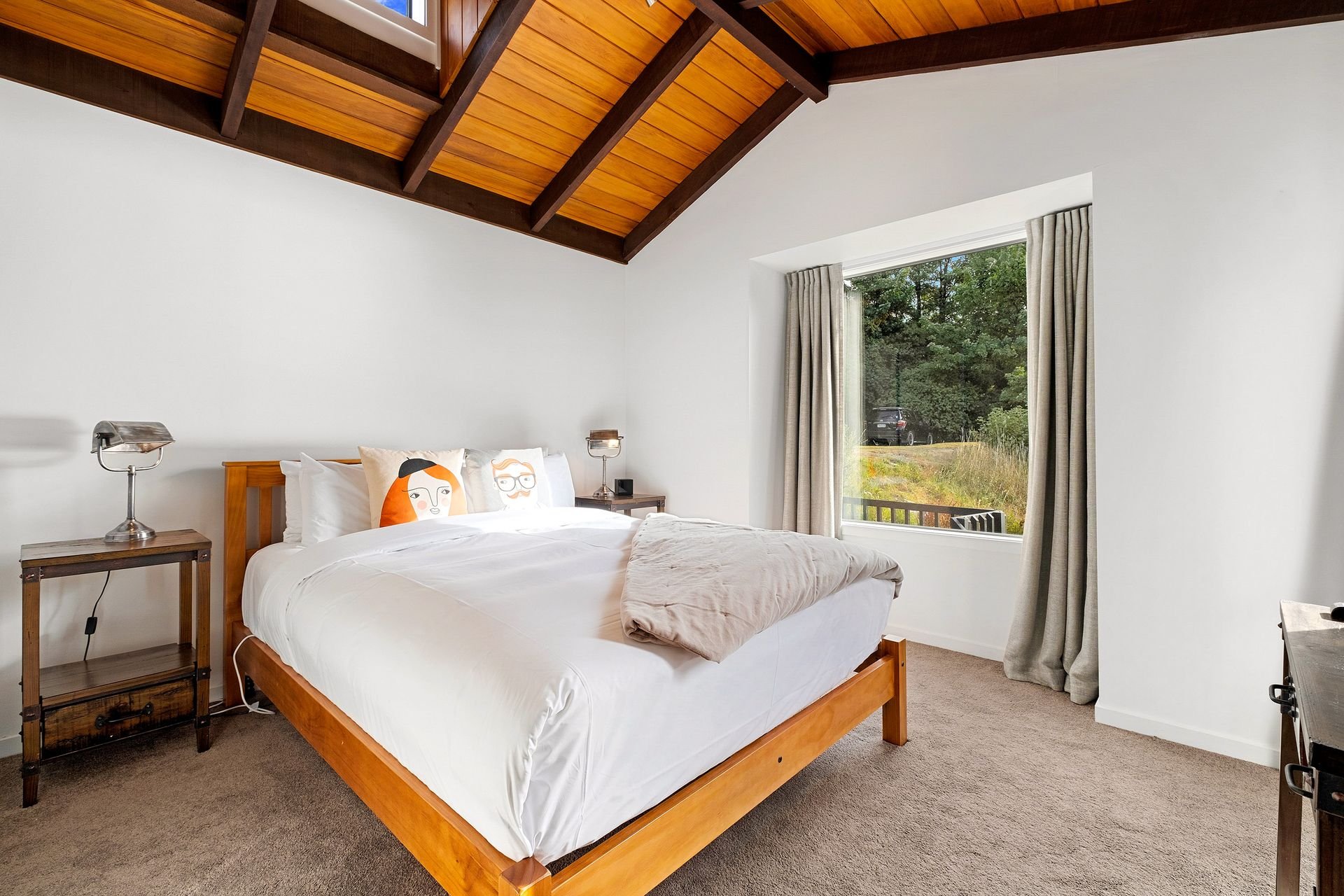 Queen bedroom with timber ceiling at Queenstown Lakefront Dream, Queenstown