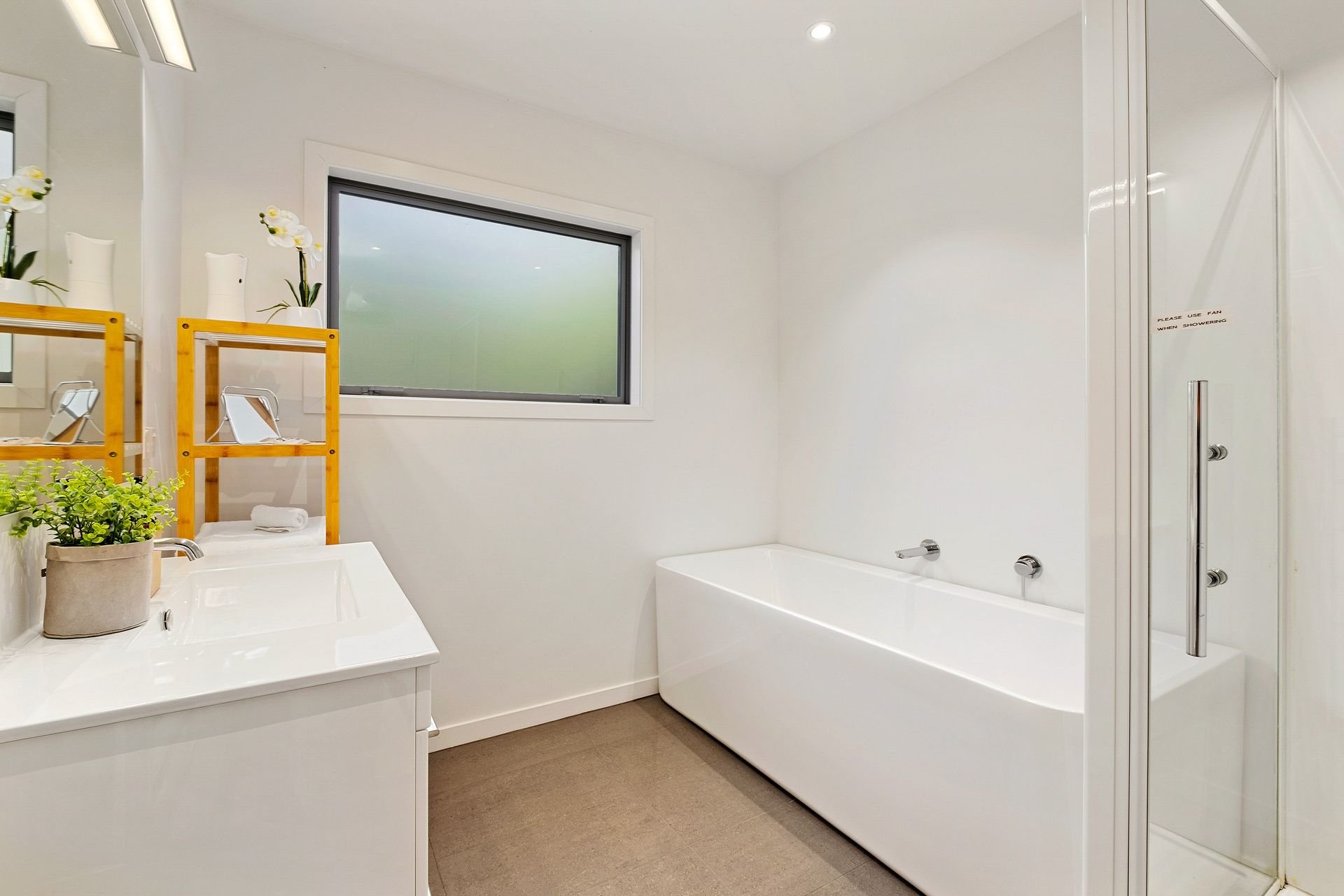 Bathroom with bath at Queenstown Lakefront Dream, Queenstown