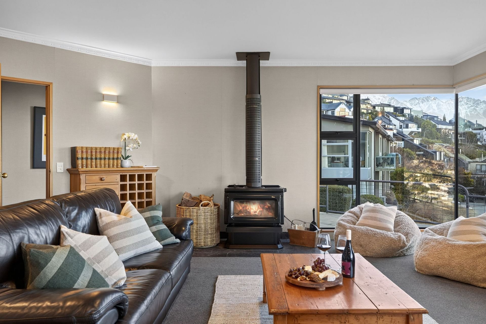 Lounge with fireplace at Alpine Haven, Queenstown