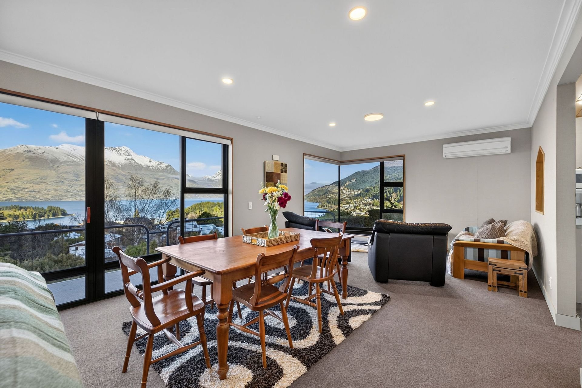 Dining table with lake views at Alpine Haven, Queenstown