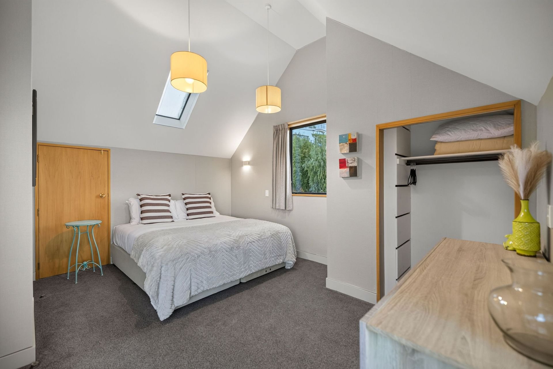 Bedroom with double bed at Alpine Haven, Queenstown