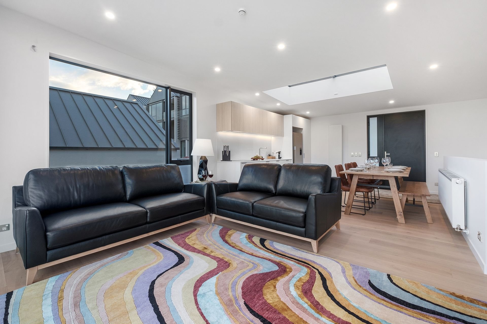 Lounge with leather sofas at Woods Villa Kea, Queenstown