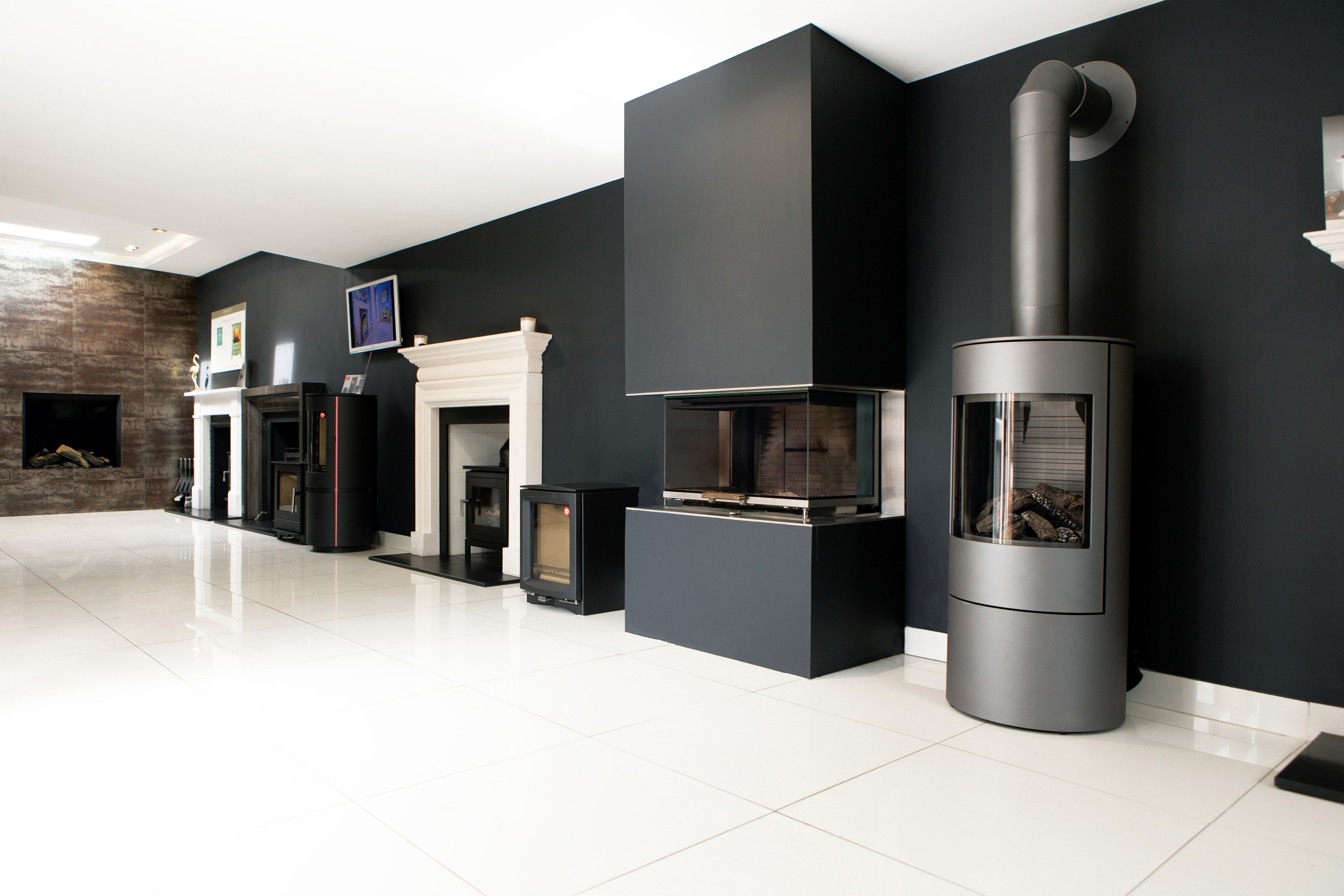 Working stoves and fireplace surrounds in our Cheltenham showroom