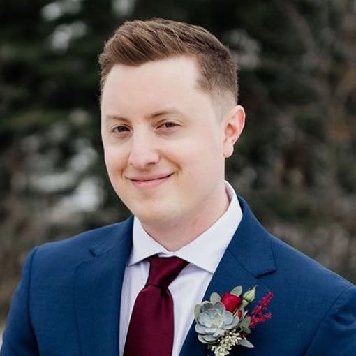 A headshot of Alex Gish at his wedding