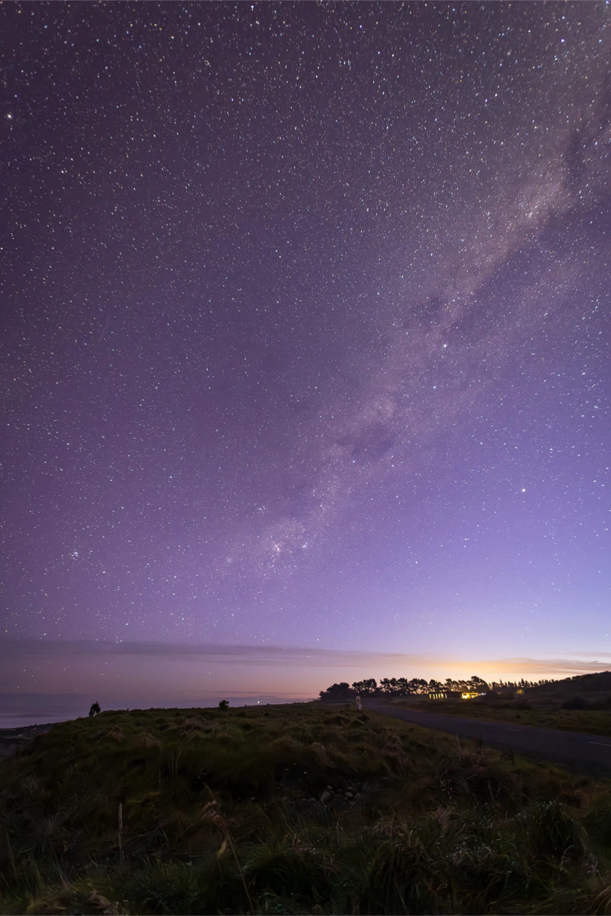 Night sky over the Kaikoura coast, the Milky Way above a roadside camping area