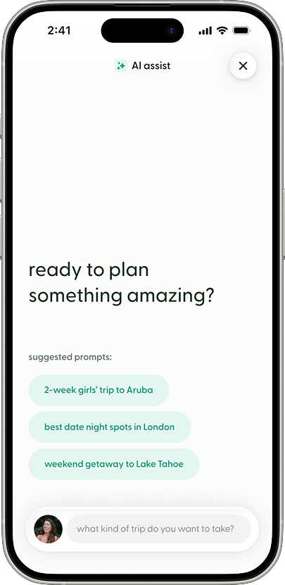 The AI Assist screen in the Flaire app, designed to help users create travel Lists using AI and Flaire’s recommendation dataset. A large prompt asks, “ready to plan something amazing?” followed by suggested trip ideas such as a two-week girls’ trip to Aruba, date night spots in London, and a weekend getaway to Lake Tahoe. At the bottom of the screen, a chat input field invites users to describe the type of trip they want to take. The AI assistant generates personalized Lists by combining user intent with recommendations sourced from the Flaire community. A close button appears in the upper-right corner.