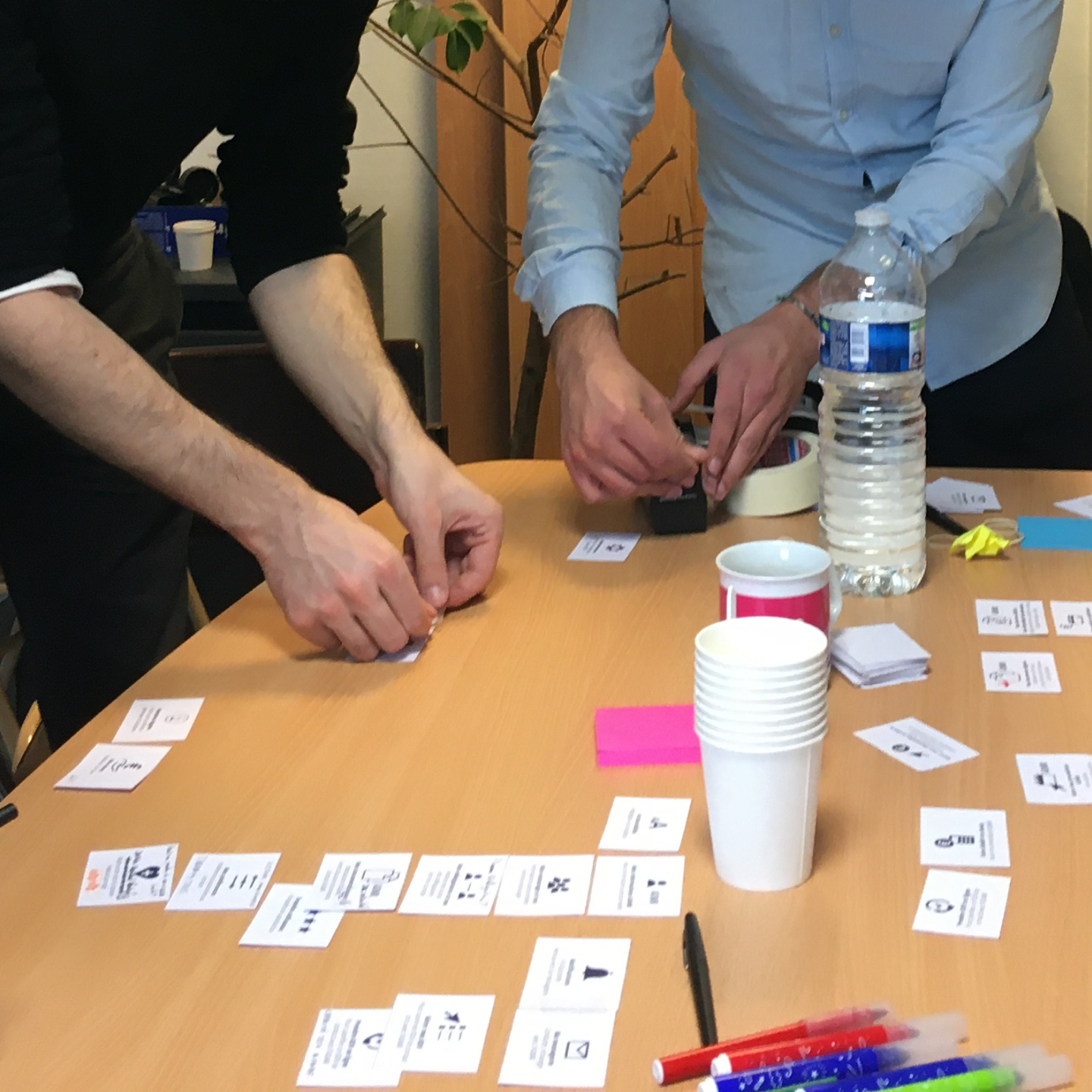 Photo showing a card sorting workshop with various participants.