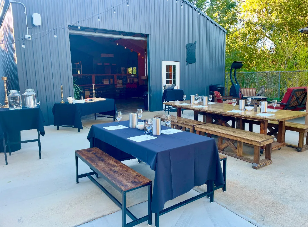 Educational wine tasting event set up on the starlight patio during the day. Tables ready with wine glasses for a fun evening of wine education.
