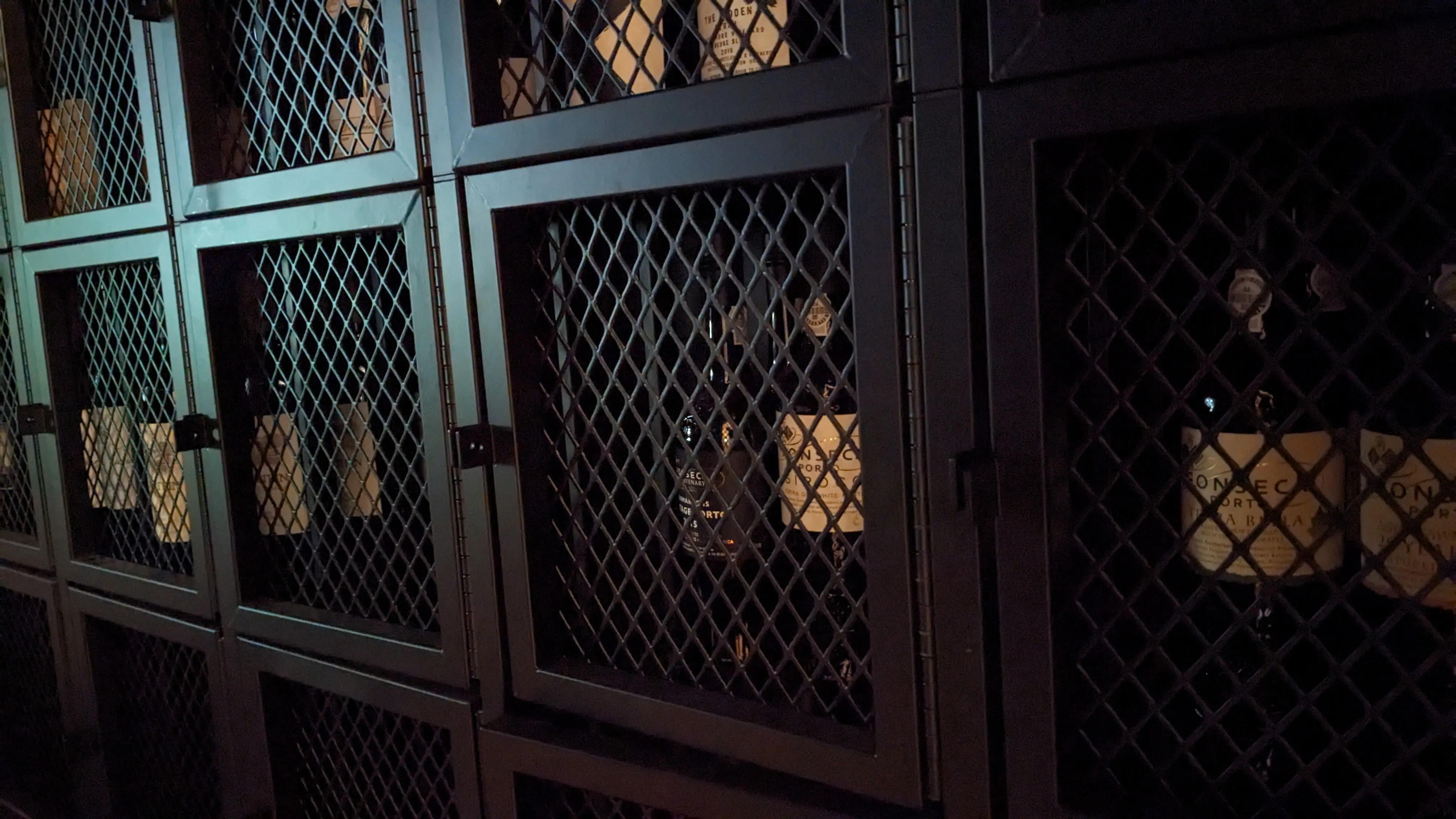 Rows of lockers with bottled wines in them.