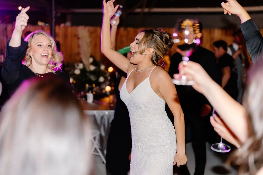 The bride dancing with guests at her wedding reception at The Betsy