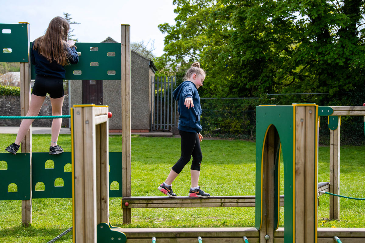 Children playing on trim trails in the uk