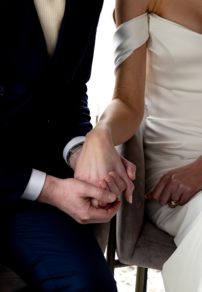 Man and wife holding hands