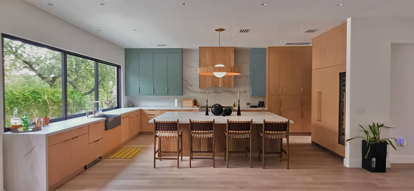Front view of a custom riff sawn white oak kitchen cabinets with custom fluted panels/doors