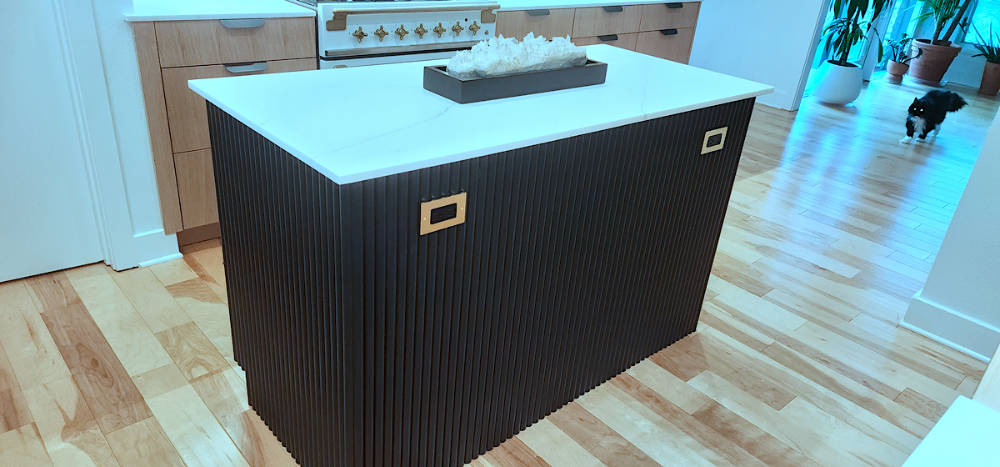 Custom riff sawn white oak kitchen cabinets with fluted painted island.