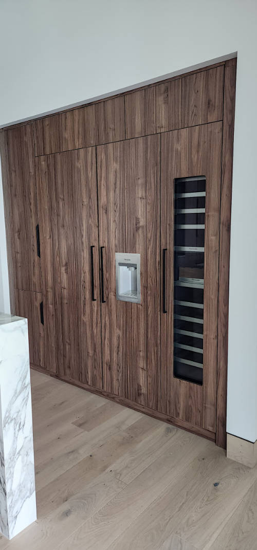 Custom dark walnut kitchen cabinets.