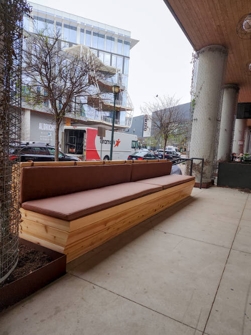 Custom cedar exterior bench with leather seats.