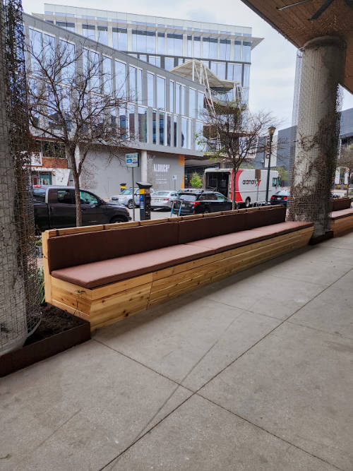 Custom cedar exterior bench with leather seats.