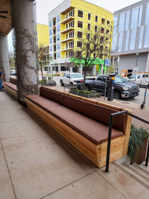 Custom cedar exterior bench with leather seats.
