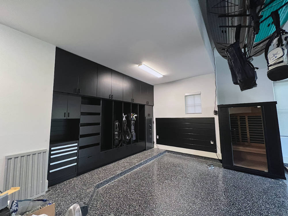 Custom garage cabinets with golf bag storage.
