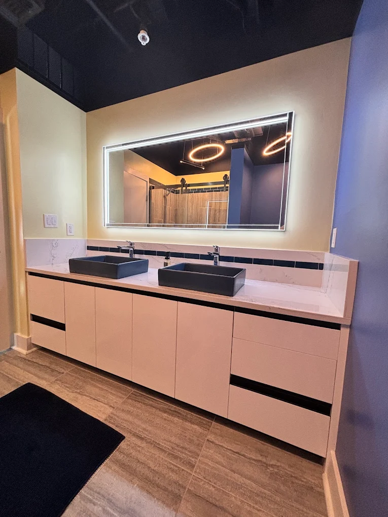 Modern European cabinets with vessel sinks.