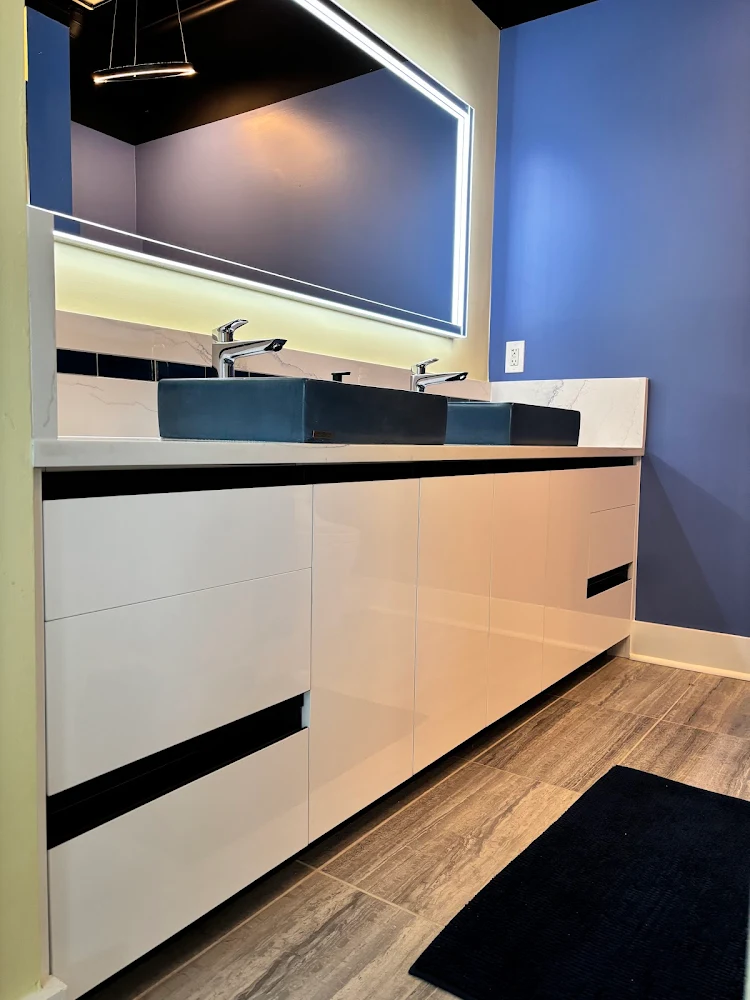 Modern European cabinets with vessel sinks.